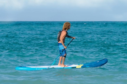 Aztron-Hydration-Bag-on-action-on-model-with-sup-board.jpg